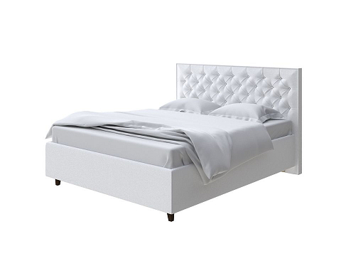Кровать из экокожи Teona Grand - Кровать с увеличенным изголовьем, украшенным благородной каретной пиковкой.
